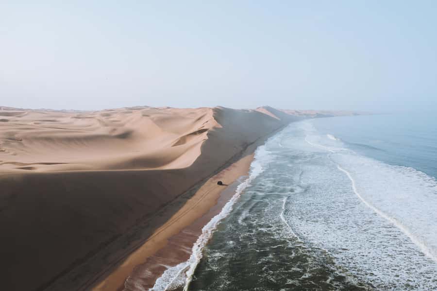 From Walvis Bay: Sandwich Harbor 4x4 Tour - Sandwich Harbor, where dunes meet the Atlantic