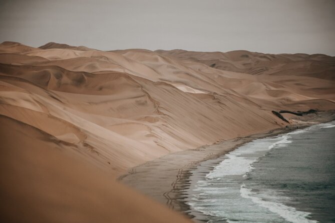 Sandwich Harbour 4x4 Guided Tour - Unforgettable Adventure - Lunch, snacks, and sparkling wine above the Atlantic